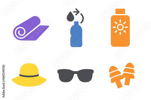 Beach essentials for a perfect sunny day with sun protection and relaxation items laid out