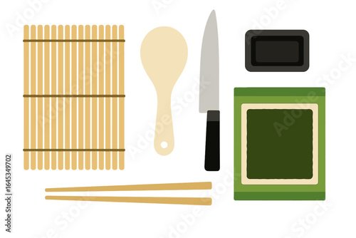 Kitchen tools arranged for sushi preparation in a modern culinary setting with a simple background