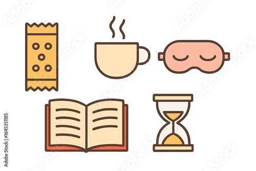 Enjoying a cozy evening with a book, snacks, tea, and relaxing elements in a comfortable setting