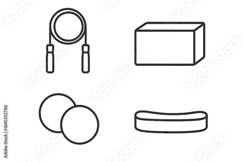 Fitness equipment including jump rope, yoga block, resistance bands, and exercise balls for a complete workout session