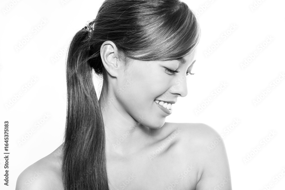 Naklejka premium Beautiful asian woman with long dark and healthy hair and clear skin
