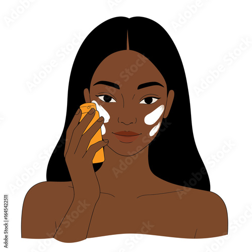 Glowing Skin Ritual: A dark-skinned woman delicately applies skincare product to her face, highlighting a focus on beauty and healthy skin. 