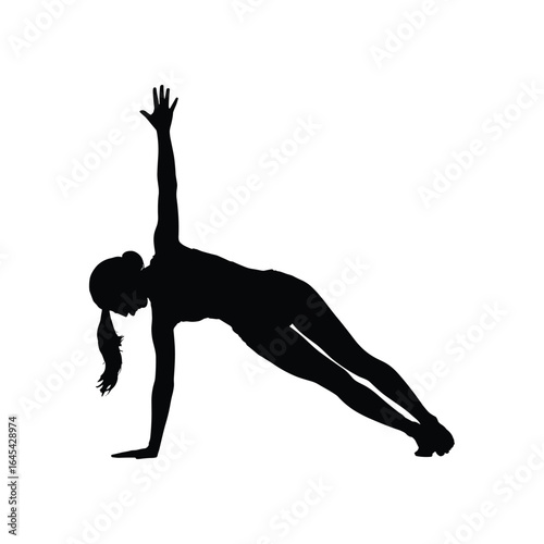 Silhouette of a woman performing a side plank yoga pose