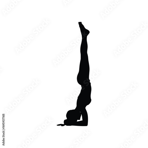 Silhouette of a woman performing a yoga headstand pose against a white background