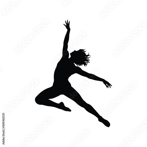 Silhouette of a female dancer in mid air leap with graceful movement