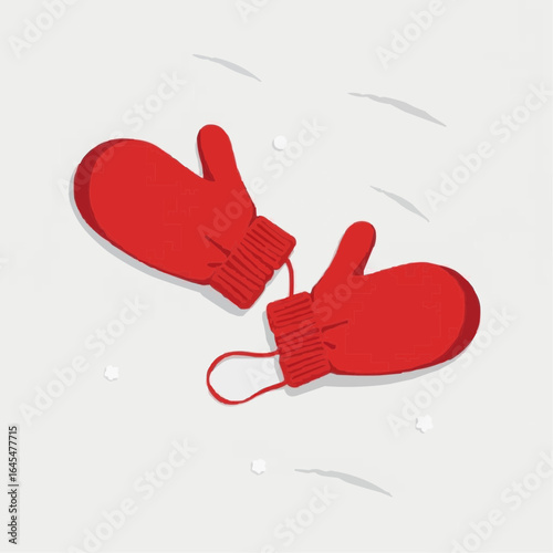 Red mittens on white background with snowflakes falling down  