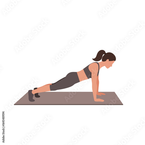 Fitness Routine: A fitness model is demonstrating proper form while performing a plank on a yoga mat, highlighting core strength and disciplined exercise.