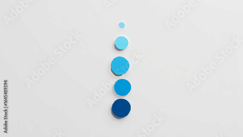 Gradient blue spheres lined up on white background

