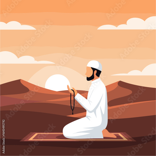 Muslim man praying with prayer beads in desert at sunset