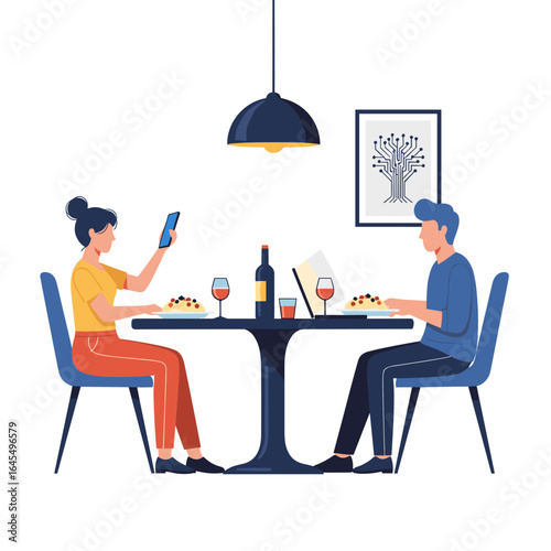 Couple using phone and laptop at dinner table