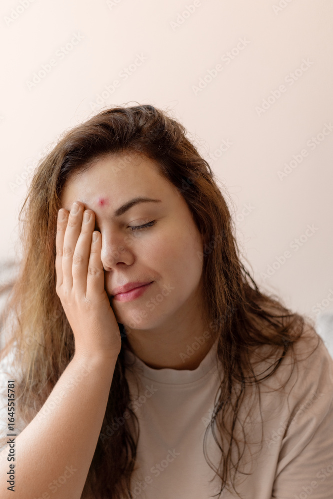 Close-up of a young woman looking distressed after noticing a new pimple on her face. Highlights natural skin imperfections, emotional response to acne, and personal skincare concerns. Close-up of a young woman looking distressed after noticing a new pimple on her face. Highlights natural skin imperfections, emotional response to acne, and personal skincare concerns.