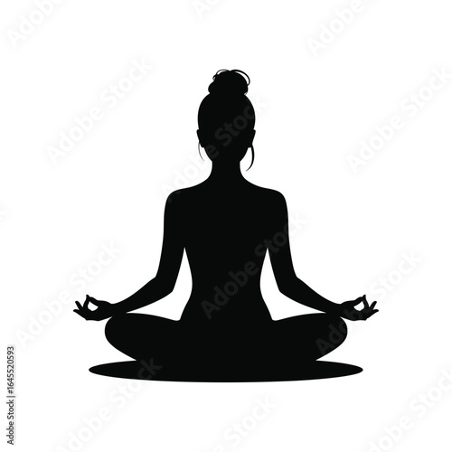 Silhouette of a woman meditating in a lotus pose with hands in mudra
