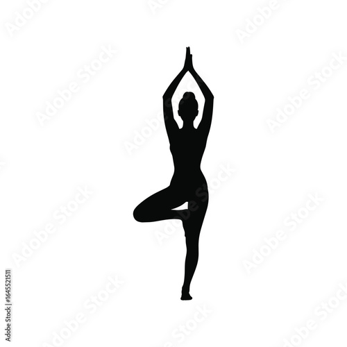 Silhouette of a woman performing a yoga tree pose