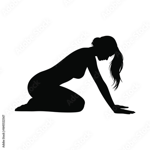 Silhouette of a woman kneeling on the floor with her head down
