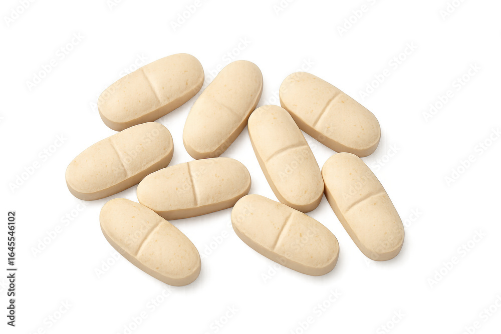 Oval vitamin pills lying on transparent background Oval vitamin pills lying on transparent background