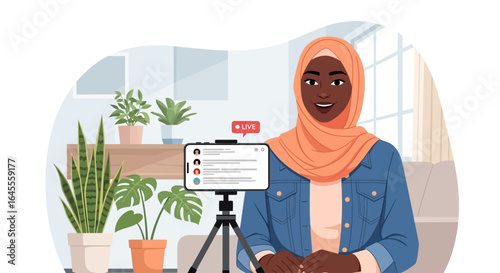 Smiling woman in hijab recording a video blog about plants and gardening.