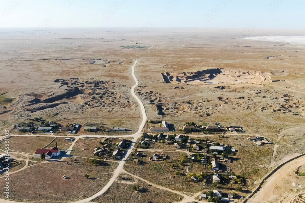 Obraz premium village near a gypsum quarry, a residential area and industry nearby.