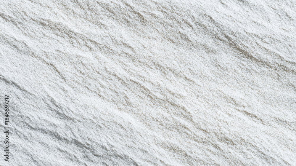 Fototapeta premium Seamless textured wall in soft gray stone tones, highlighted by natural ambient light.