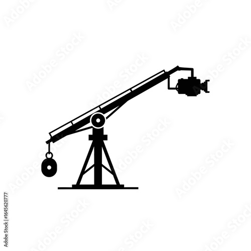 A crane lifts an object. A camera is mounted on the crane's arm.