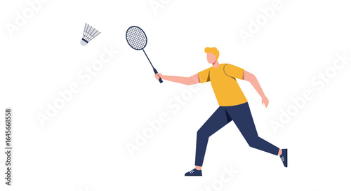 Dynamic badminton player hitting the shuttlecock with racket during energetic game play
