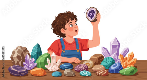 Curious young boy examining his collection of crystals and minerals.