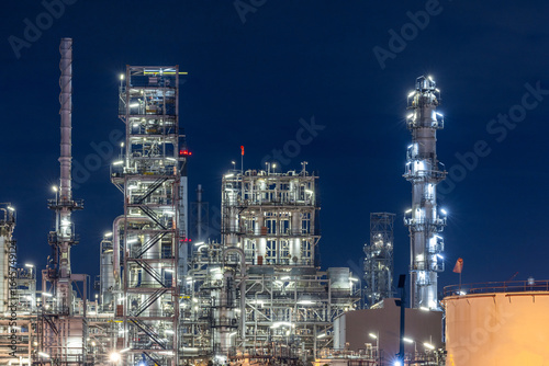 Wallpaper Mural Oil and gas refinery plant at night, Global business energy logistic transportation, Oil and gas refinery petrochemical industrial, Petrochemical refinery industrial energy supply chain. Torontodigital.ca