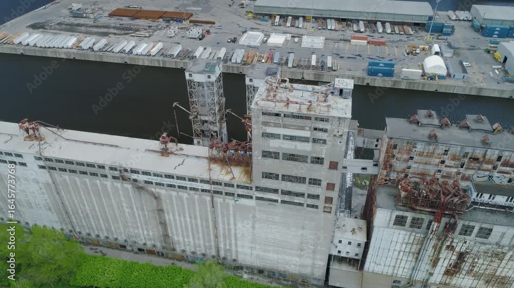 Aerial view of the abandoned, historic, Pointe-du-Moulin grain elevator complex, located in Montreal, Quebec, Canada. The elevators sit along the canal. Lachine Canal National Historic Site. Aerial view of the abandoned, historic, Pointe-du-Moulin grain elevator complex, located in Montreal, Quebec, Canada. The elevators sit along the canal. Lachine Canal National Historic Site.