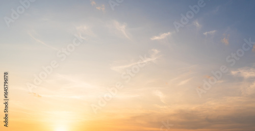 Fototapeta Naklejka Na Ścianę i Meble -  Golden Sky, Sunset sky cloud in Autumn Evening with Orange, Yellow, Blue sunlight, Horizon nature Golden hour Warm morning sunrise sky Background