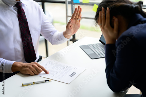 Employer rejecting job applicant during interview for a position in company office