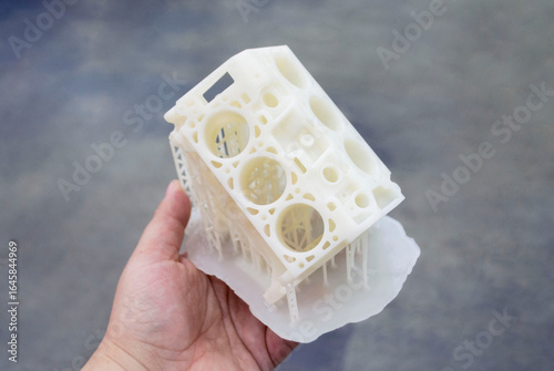 Detailed models in form of internal combustion engine printed on 3D printer from polymer close-up. Detailed object created by 3D printer using 3D printing method. Concept 3D Printing. SLA technology