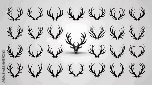 Collection of various black deer antlers on a light background