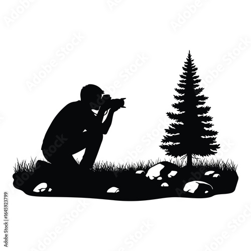 Silhouette vector art of silhouette of a photographer kneeling to capture a photo of a tree