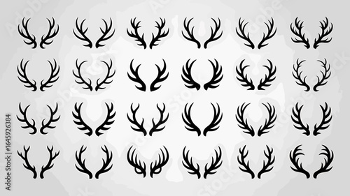 Collection of various black deer antlers on a light background
