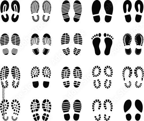 Diverse collection of black footprints and shoe prints displaying different treads and patterns