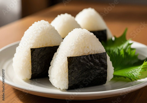 Japanese Onigiri Rice Balls Wrapped in Nori on a Plate