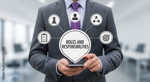 Confident businessman using smartphone to visualize team roles and responsibilities with strategic icons in modern office setting