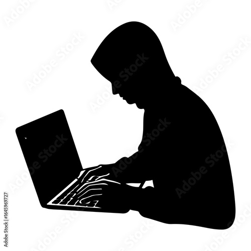 Silhouette of a hacker using a laptop to commit cybercrime and steal data online in a dark environment