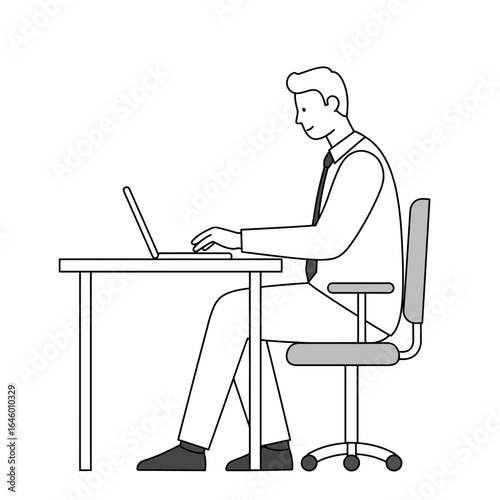 Side view of a man in a shirt and tie working on a laptop at an office desk.