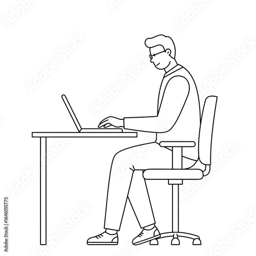 Side view of a man in a shirt and tie working on a laptop at an office desk.