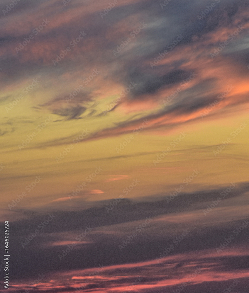 Fototapeta premium Glowing clouds in a radiant sunset sky
