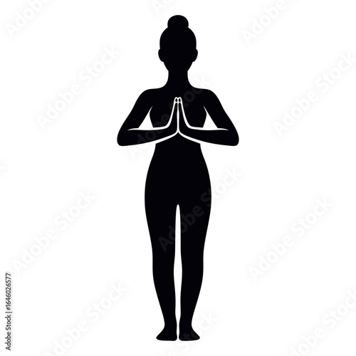 Silhouette of a woman in a prayer pose
