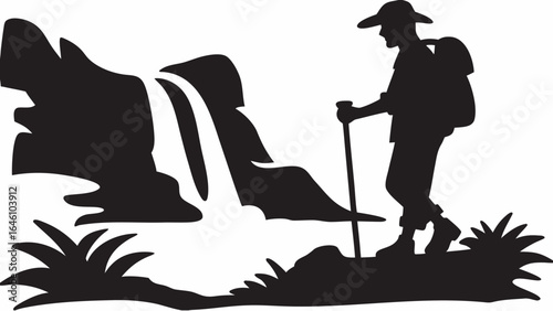 Silhouette of a hiker with backpack and walking stick near a waterfall and lush vegetation area view