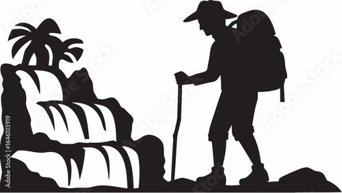 Silhouette of a hiker with backpack and walking stick near a waterfall with palm trees behind it