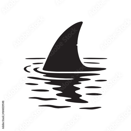 Shark fin cutting through calm morning water.