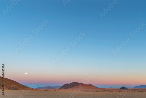 The full moon set in the west before sunrise