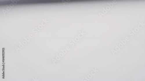 Unfolding Paper - Smooth Transition Timelapse - A macro shot of a crumpled piece of paper slowly unfolding and smoothing out. This time-lapse video shows a subtle yet compelling transformation.