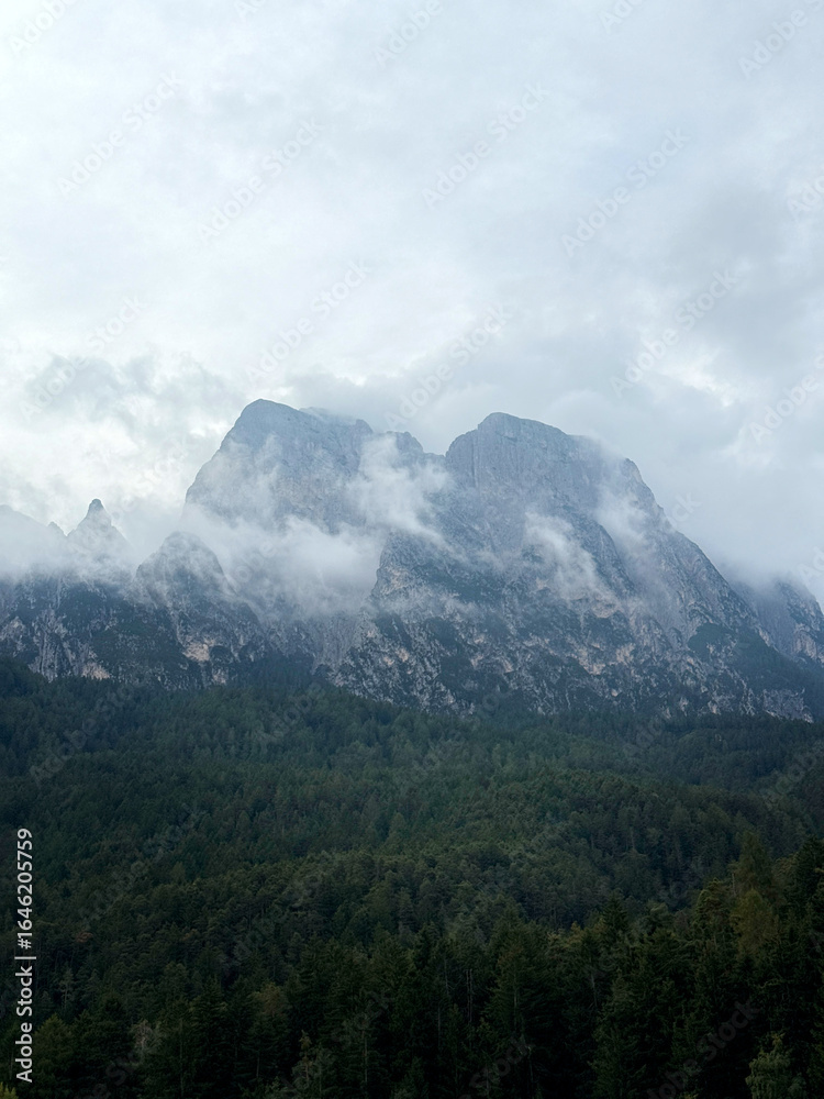 Fototapeta premium Mountain peaks in the Dolomite Alps in the clouds