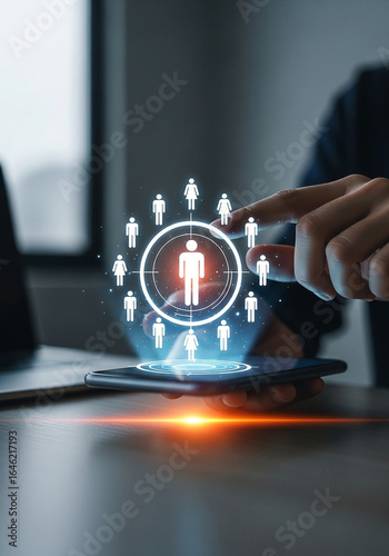 Photo of a person is selecting a human resource icon on a digital interface representing talent acquisition and employee management