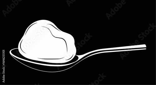 Elegant spoonful of rich, creamy butter ready for baking or cooking delicious meals