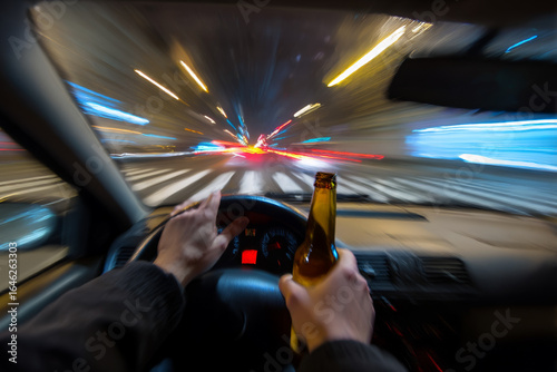 Drunk driver's POV: blurred night road with bottle in hand, dangerous impaired driving scene.